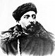 A bearded man of about 30 years in fur hat and winter coat.
